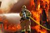 An image of a firefighter tackling a large blaze
