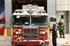 Firefighters and fire truck near the FDNY Ten House on Liberty Steet on lower Manhattan.