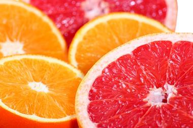 An image showing oranges and grapefruit