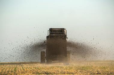 Tractor fertilising field