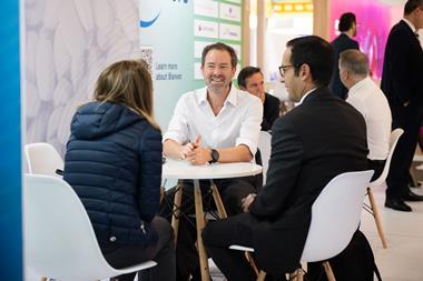 A group of professionals networking at a conference